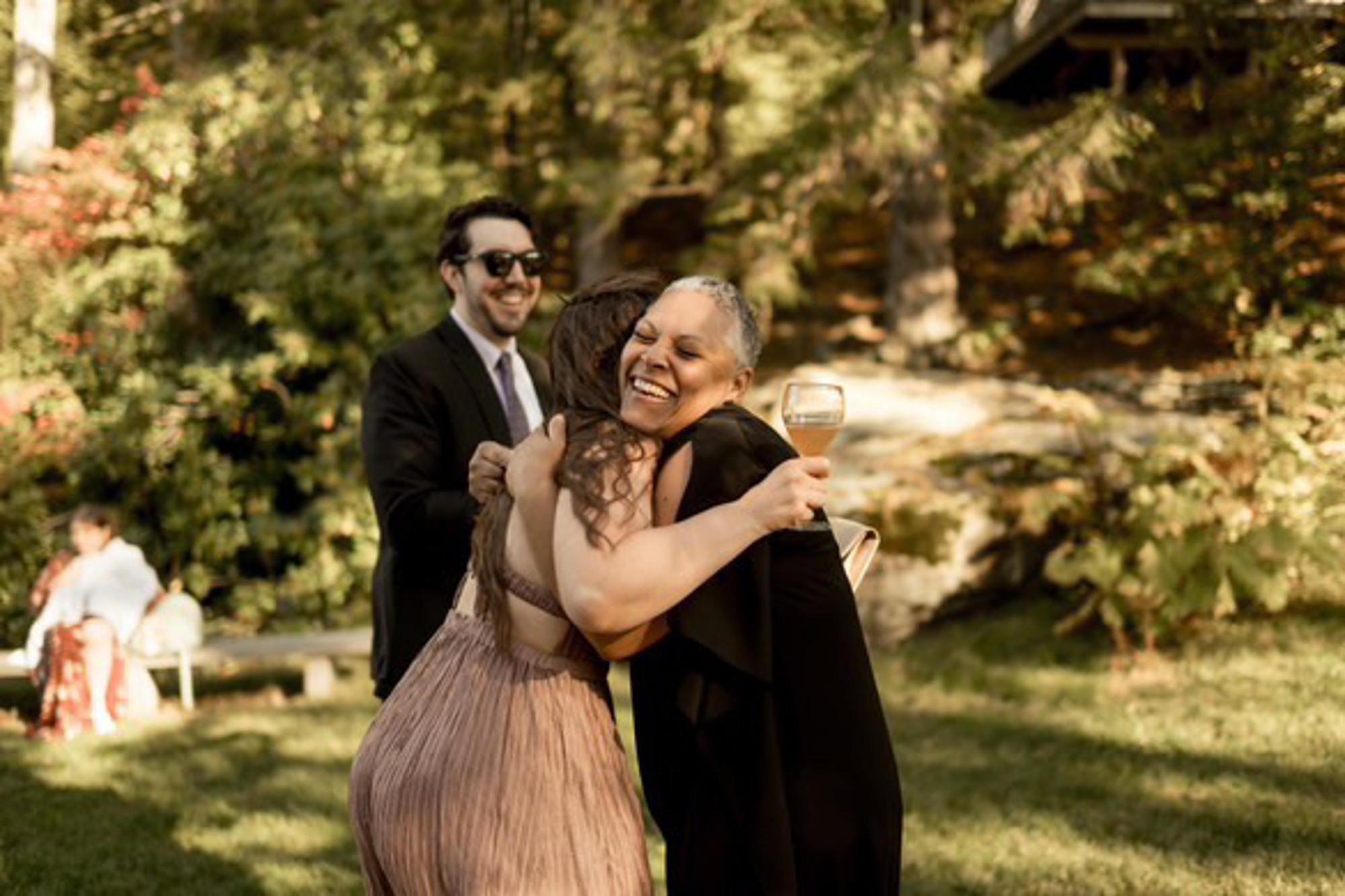 The Officiant embracing a previous bride at a wedding — Melissa Cervantes Photo